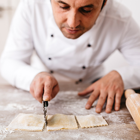 Chef prepares pasta