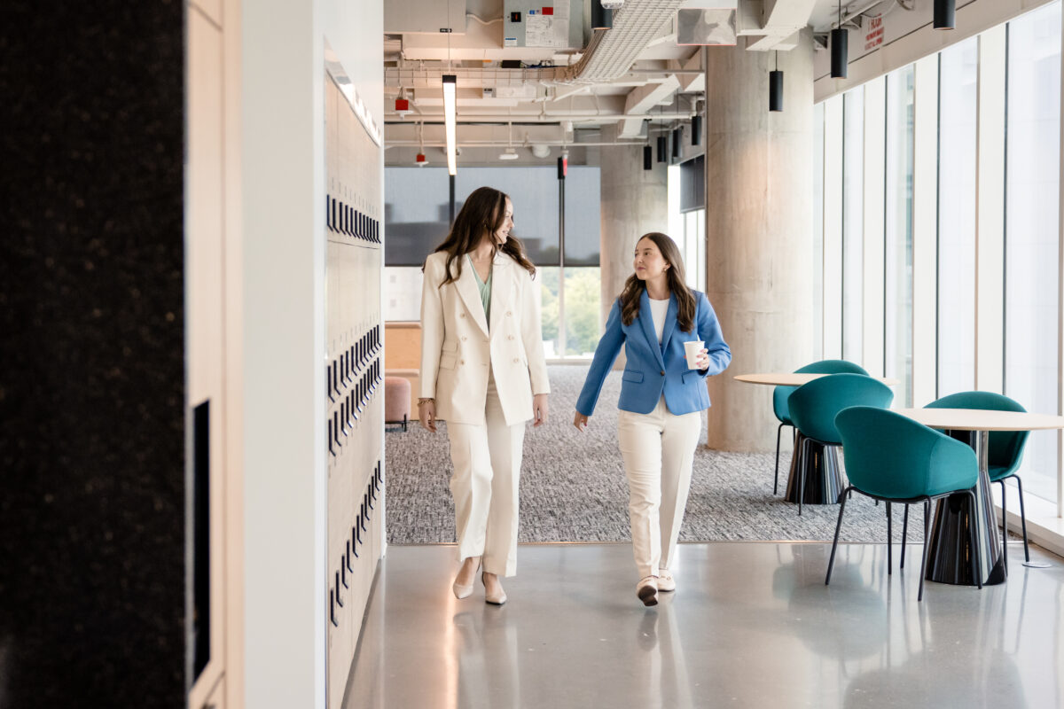 two marriott associates walking discussing marriott employee benefits